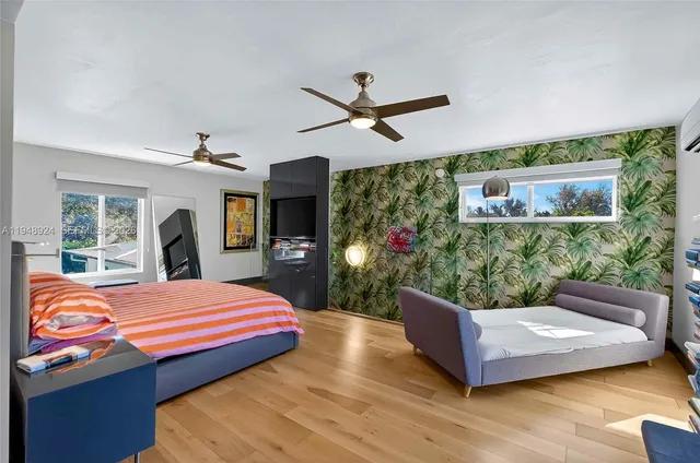 a bed room with a bed window and dresser