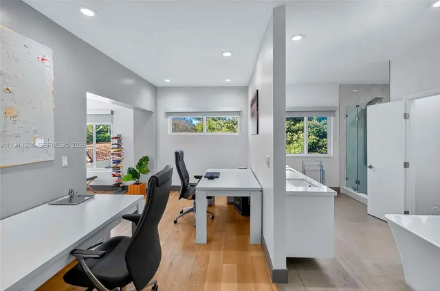 a view of a dining room with furniture window and wooden floor