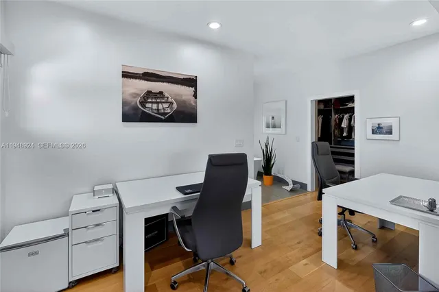 a workspace with furniture and wooden floor