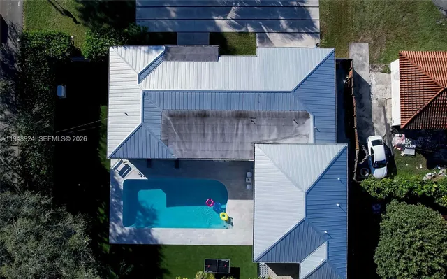 a aerial view of a house with a yard