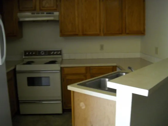 a kitchen with a stove and a microwave
