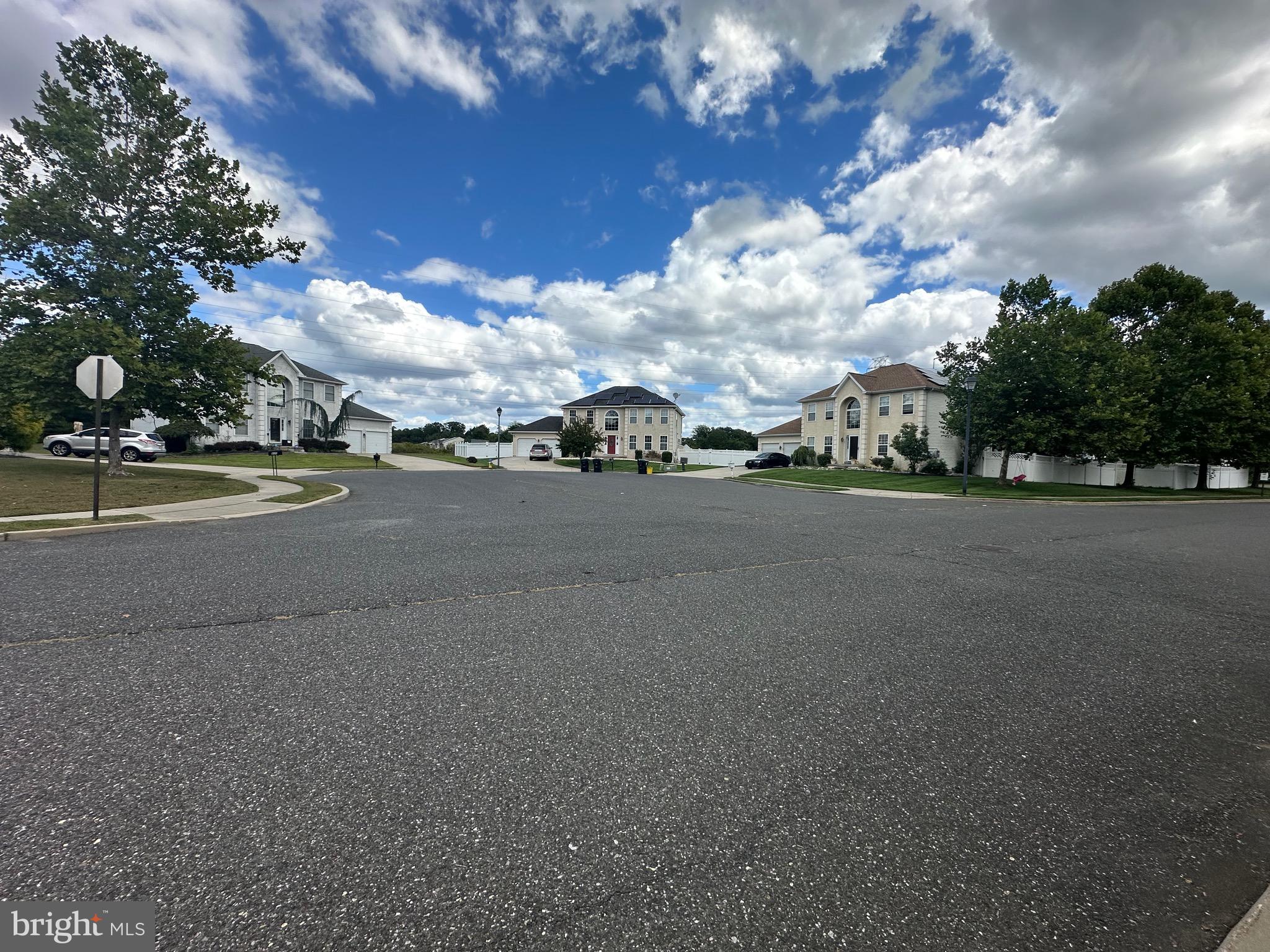 109 Harmony Cir Road Sicklerville, NJ 08081 - Photo 10 of 118 a view of a city street with a building in the background