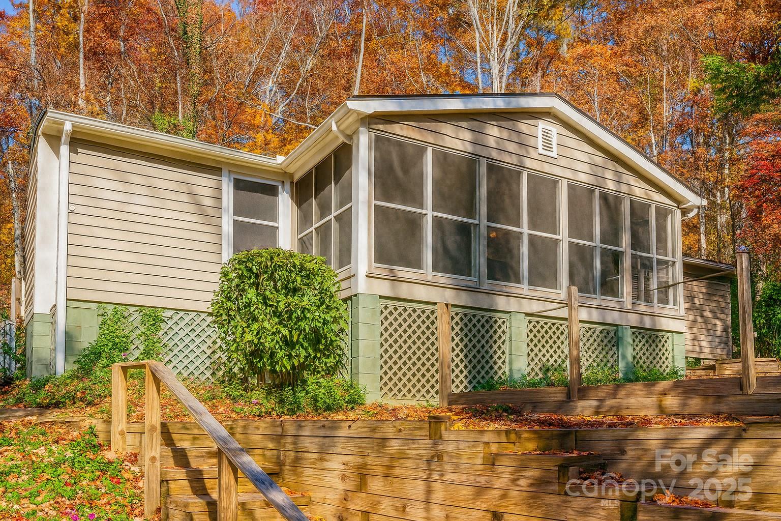 243 Boys Camp Road Black Mountain, NC 28711 - Photo 1 of 21 a front view of a house with a yard