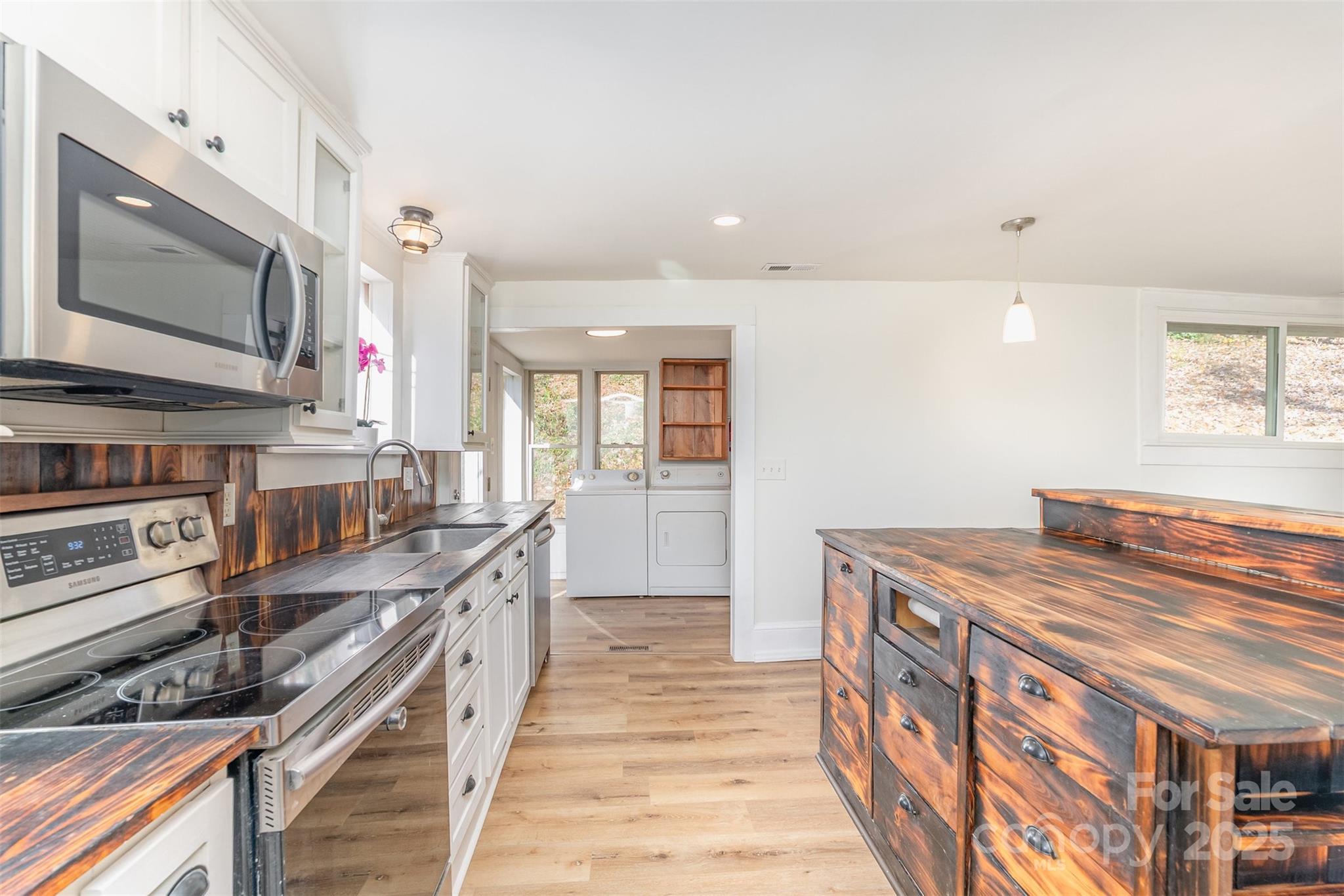 243 Boys Camp Road Black Mountain, NC 28711 - Photo 11 of 21 a kitchen with stainless steel appliances granite countertop a sink and a stove