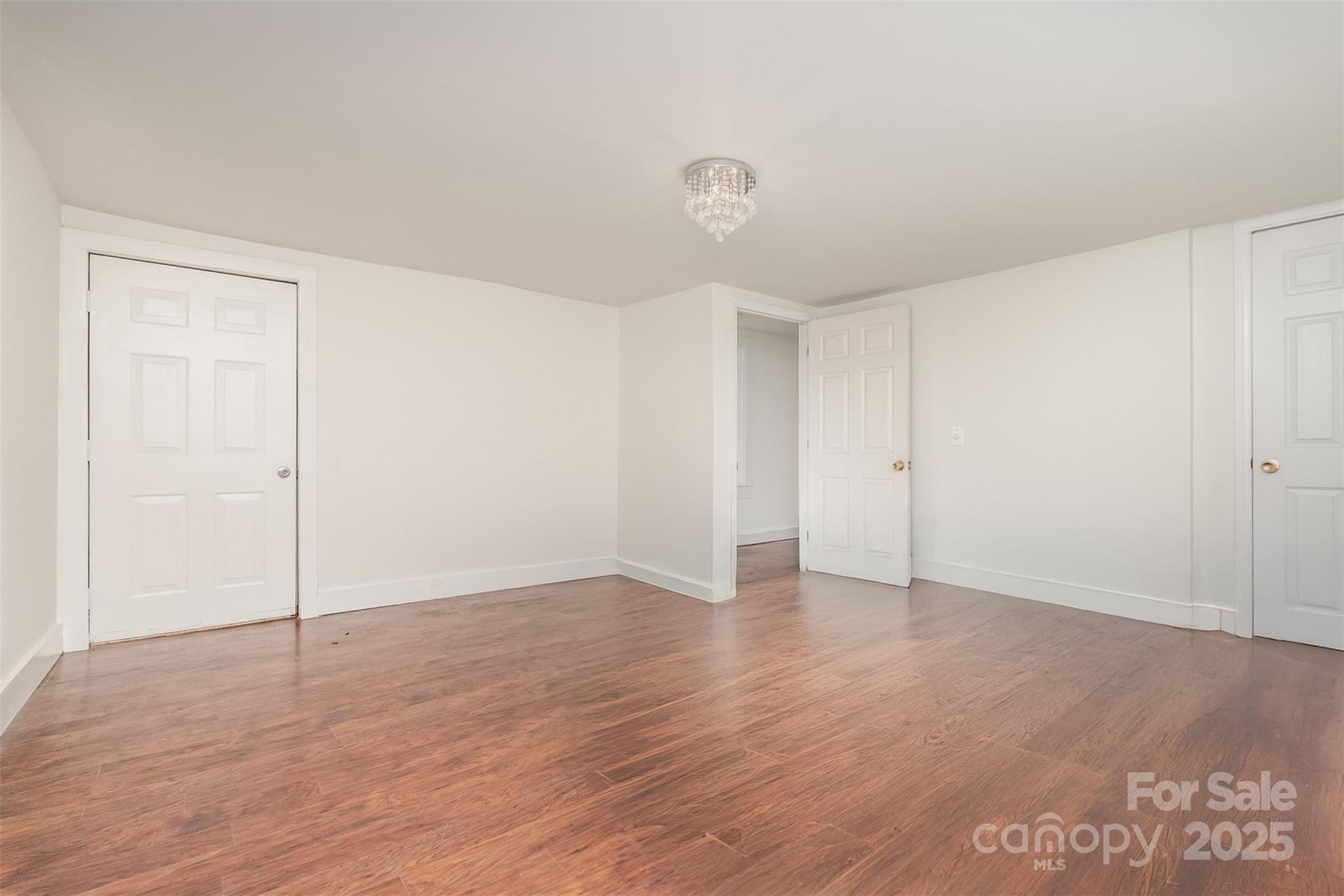 243 Boys Camp Road Black Mountain, NC 28711 - Photo 15 of 21 a view of an empty room with wooden floor