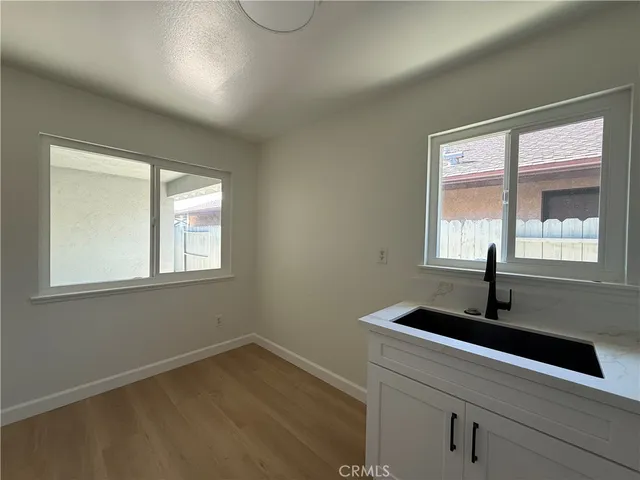 a sink sitting next to a window