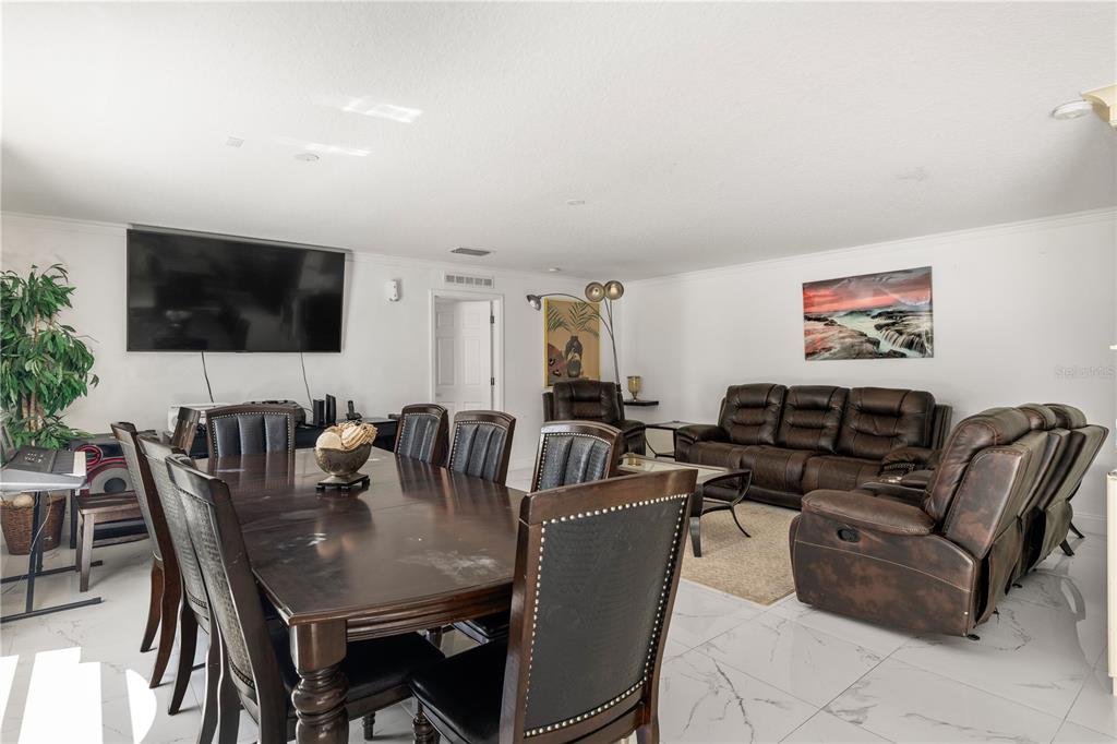 51 Uhl Path Palm Coast, FL 32164 - Photo 19 of 68 a view of a livingroom with furniture and a flat screen tv