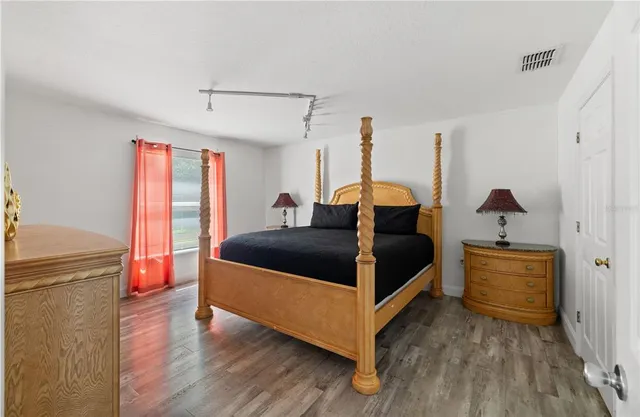 a living room with furniture potted plant and a window