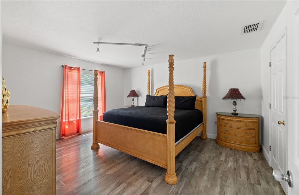 51 Uhl Path Palm Coast, FL 32164 - Photo 20 of 68 a bedroom with a bed and a dresser