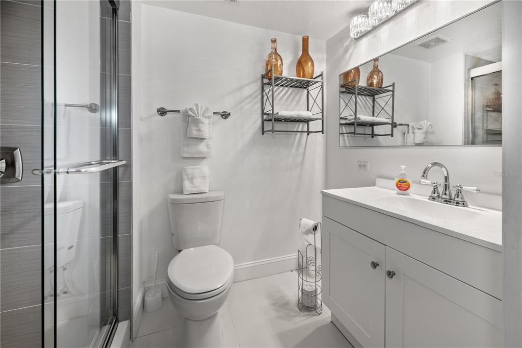 51 Uhl Path Palm Coast, FL 32164 - Photo 22 of 68 a white toilet sitting next to a bathroom sink