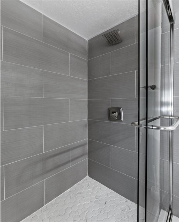 51 Uhl Path Palm Coast, FL 32164 - Photo 23 of 68 a bathroom with a glass door shower