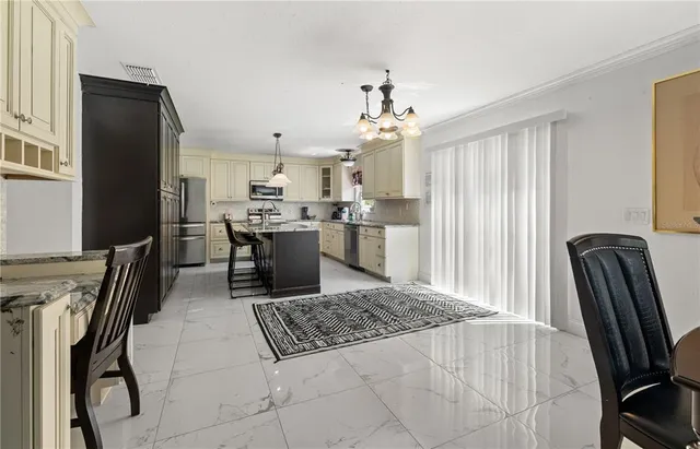 a living room with furniture a rug and a flat screen tv