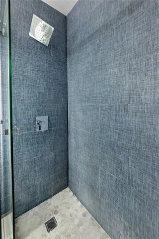 a bedroom with two beds and a chandelier