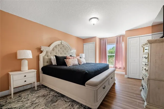 a bedroom with double bed and a window