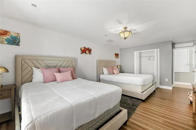 a bathroom with a sink mirror and vanity