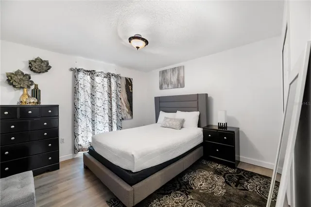 a white toilet sitting next to a shower