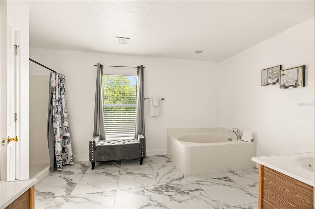 51 Uhl Path Palm Coast, FL 32164 - Photo 49 of 68 a bathroom with a bathtub sink and toilet