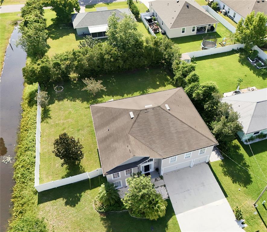 51 Uhl Path Palm Coast, FL 32164 - Photo 57 of 68 an aerial view of a house with a yard basket ball court and a patio