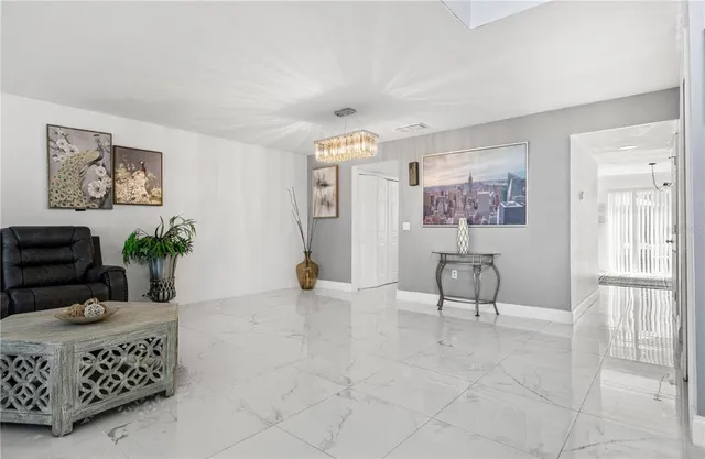 a kitchen with a sink a counter and refrigerator