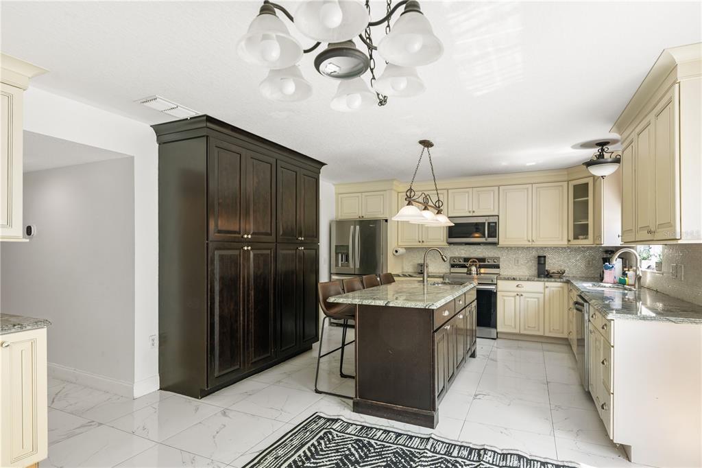 51 Uhl Path Palm Coast, FL 32164 - Photo 9 of 68 a kitchen with a refrigerator a sink and dishwasher