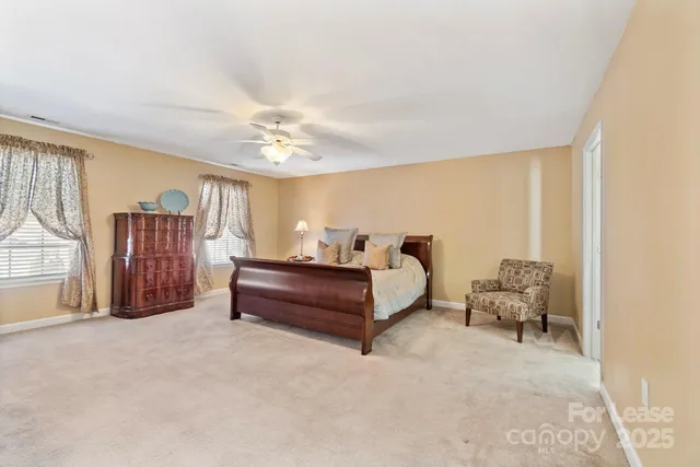 a bed room with furniture and a chandelier
