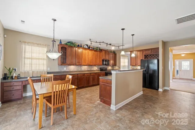 a kitchen with kitchen island granite countertop lots of counter top space