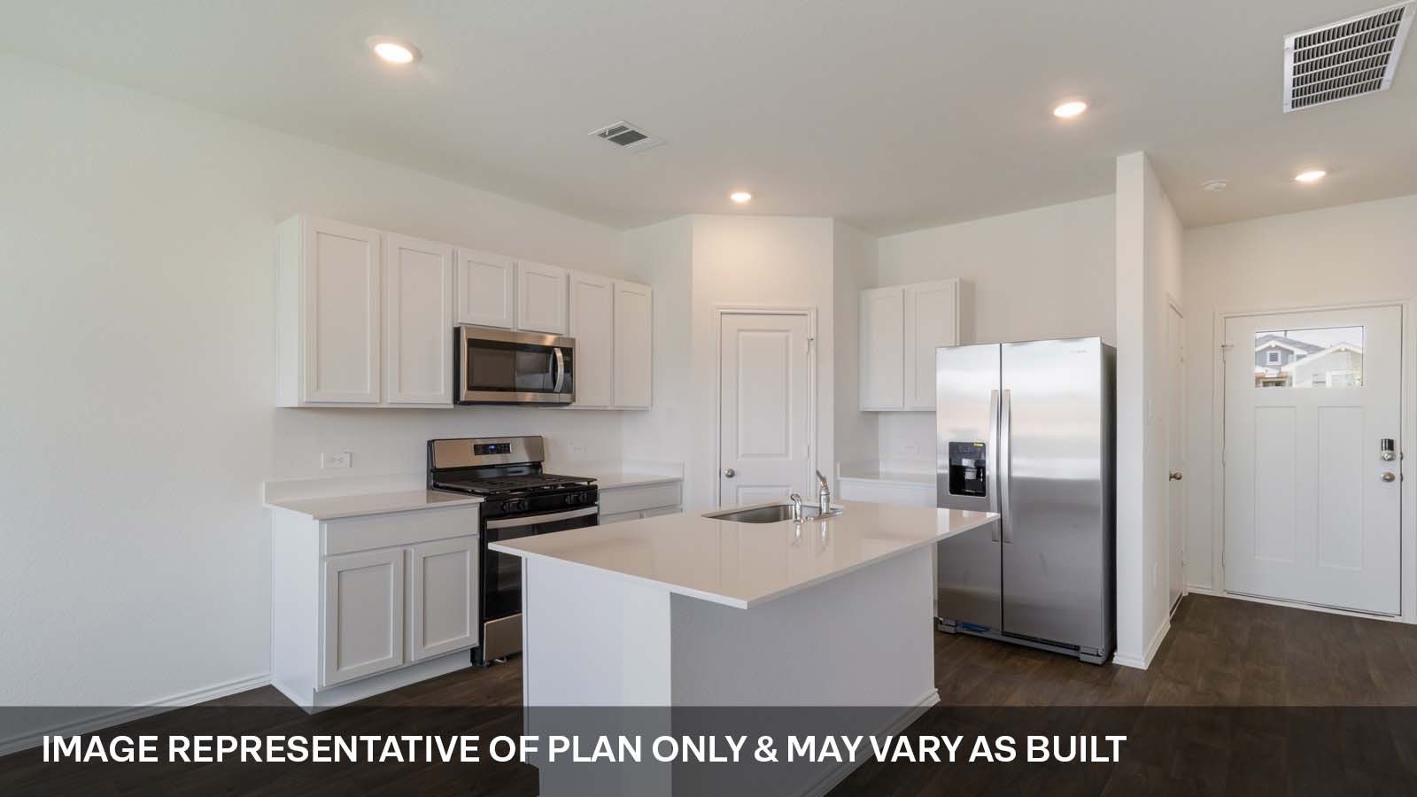 1181 Celosia Loop Kyle, TX 78640 - Photo 2 of 17 a kitchen with stainless steel appliances a refrigerator sink and microwave