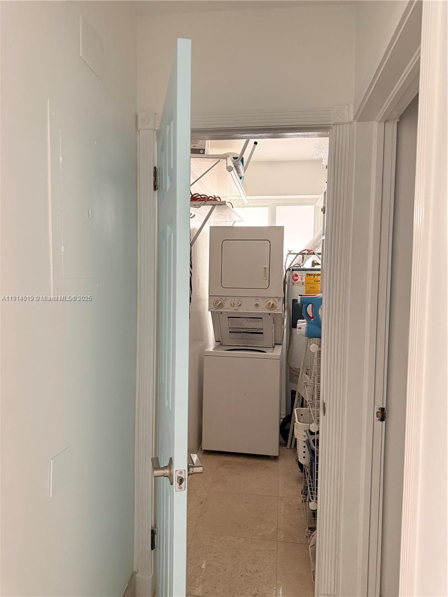 180 Isle Of Venice Drive, Unit 100 Fort Lauderdale, FL 33301 - Photo 15 of 16 a utility room with dryer and washer