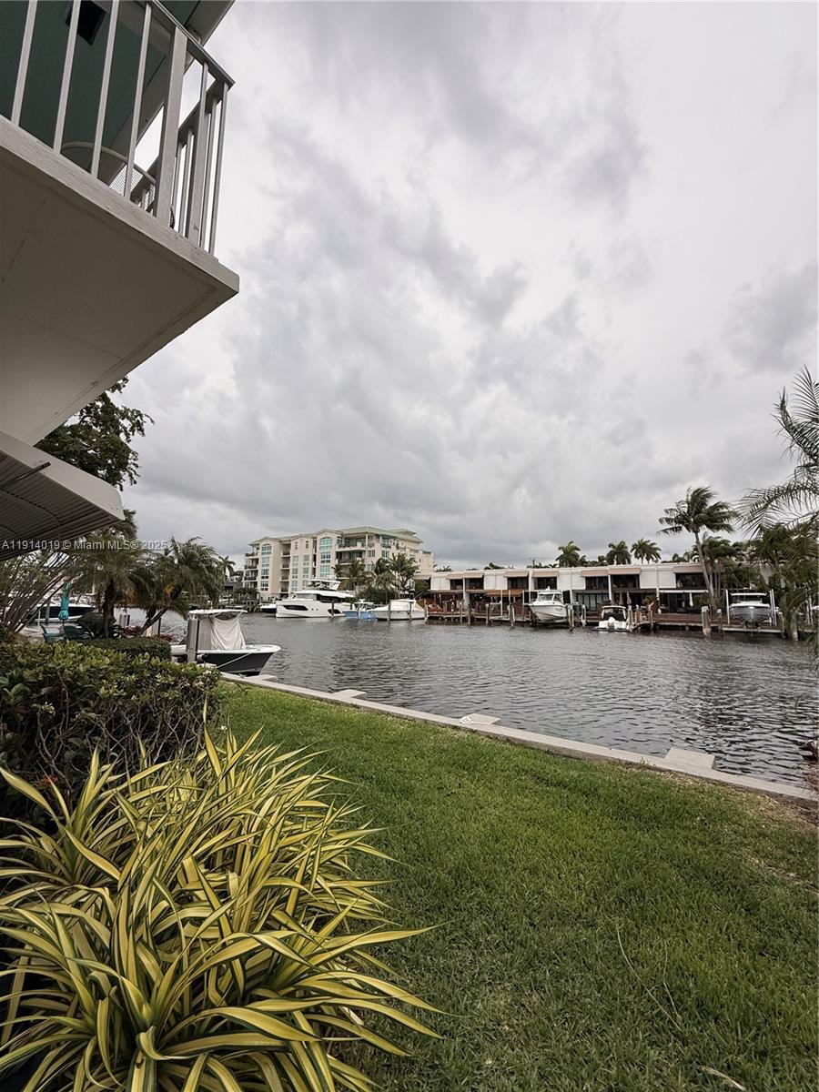 180 Isle Of Venice Drive, Unit 100 Fort Lauderdale, FL 33301 - Photo 2 of 16 a view of a lake with houses