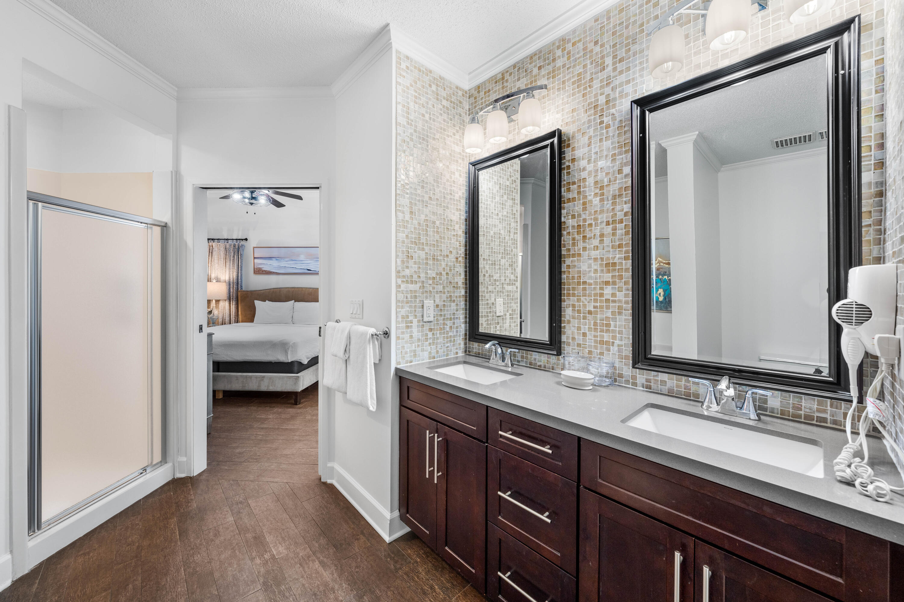 550 Tops'l Beach Boulevard, Unit 1509 Miramar Beach, FL 32550 - Photo 15 of 31 a en suite bathroom with a double vanity sink and a mirror