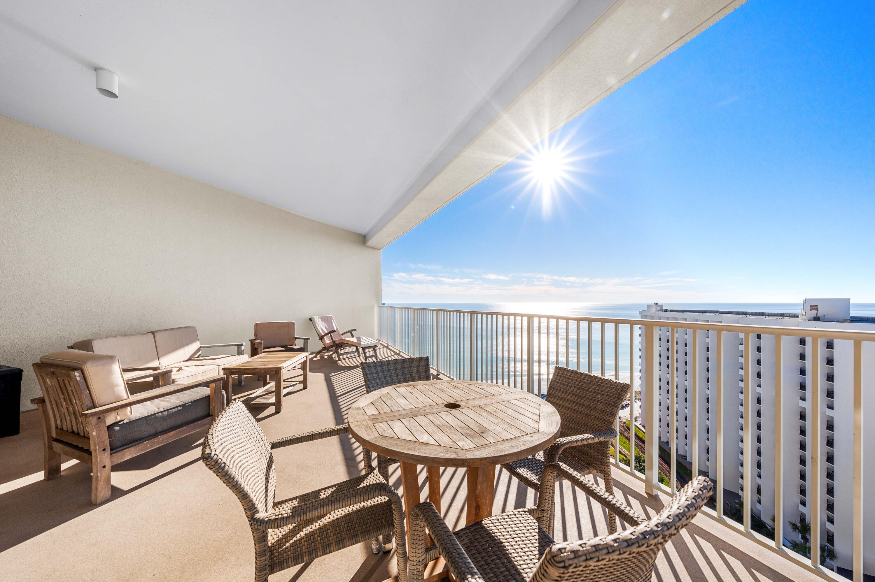 550 Tops'l Beach Boulevard, Unit 1509 Miramar Beach, FL 32550 - Photo 20 of 31 a balcony with a table and chairs