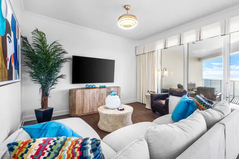 a living room with furniture and a flat screen tv