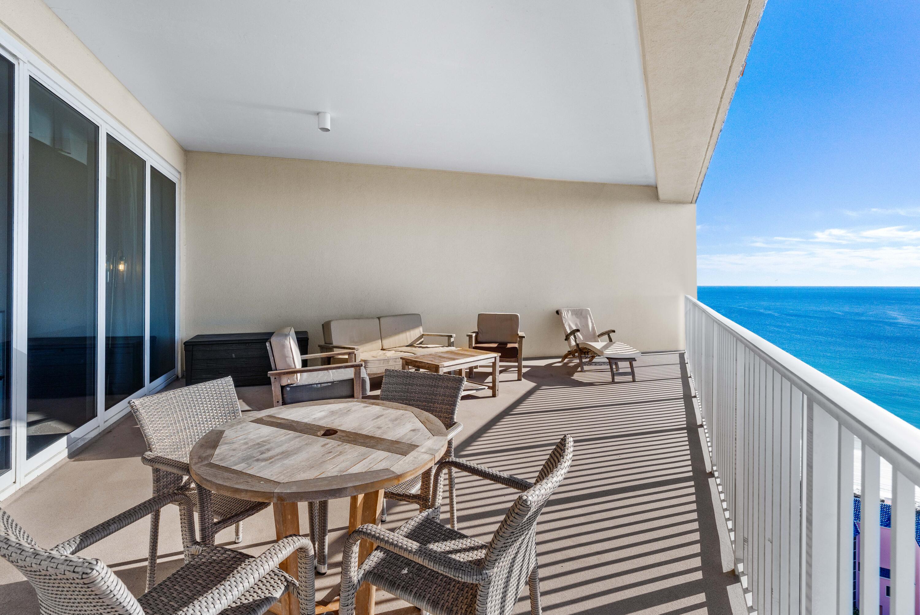 550 Tops'l Beach Boulevard, Unit 1509 Miramar Beach, FL 32550 - Photo 21 of 31 a view of a terrace with furniture and wooden floor
