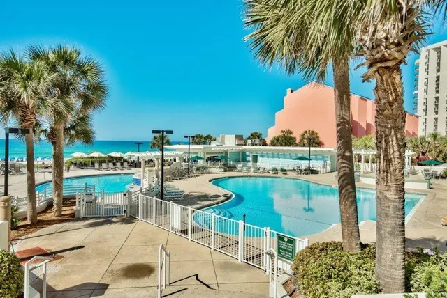 a view of a swimming pool with an outdoor space and seating area