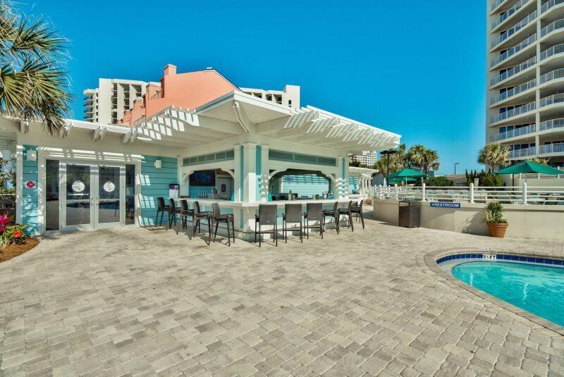 550 Tops'l Beach Boulevard, Unit 1509 Miramar Beach, FL 32550 - Photo 28 of 31 a view of a chairs and table in patio