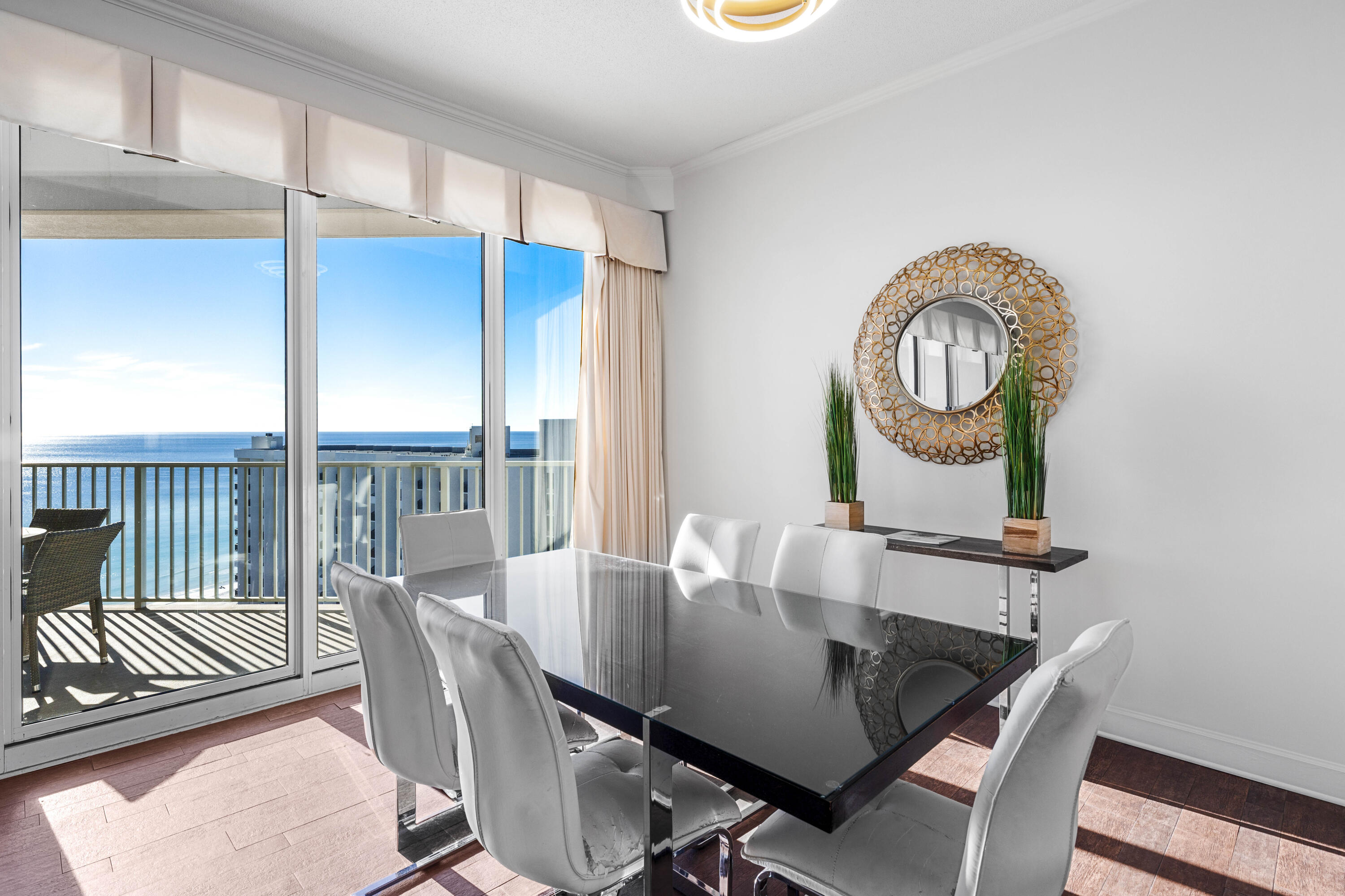 550 Tops'l Beach Boulevard, Unit 1509 Miramar Beach, FL 32550 - Photo 5 of 31 a view of a dining room with furniture and wooden floor