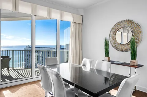 a view of a dining room with furniture window and outside view