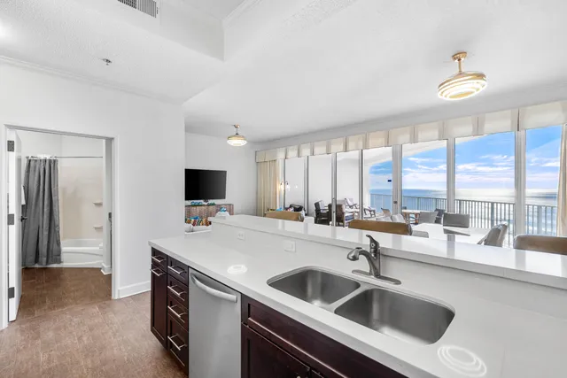 a kitchen with a sink and a refrigerator