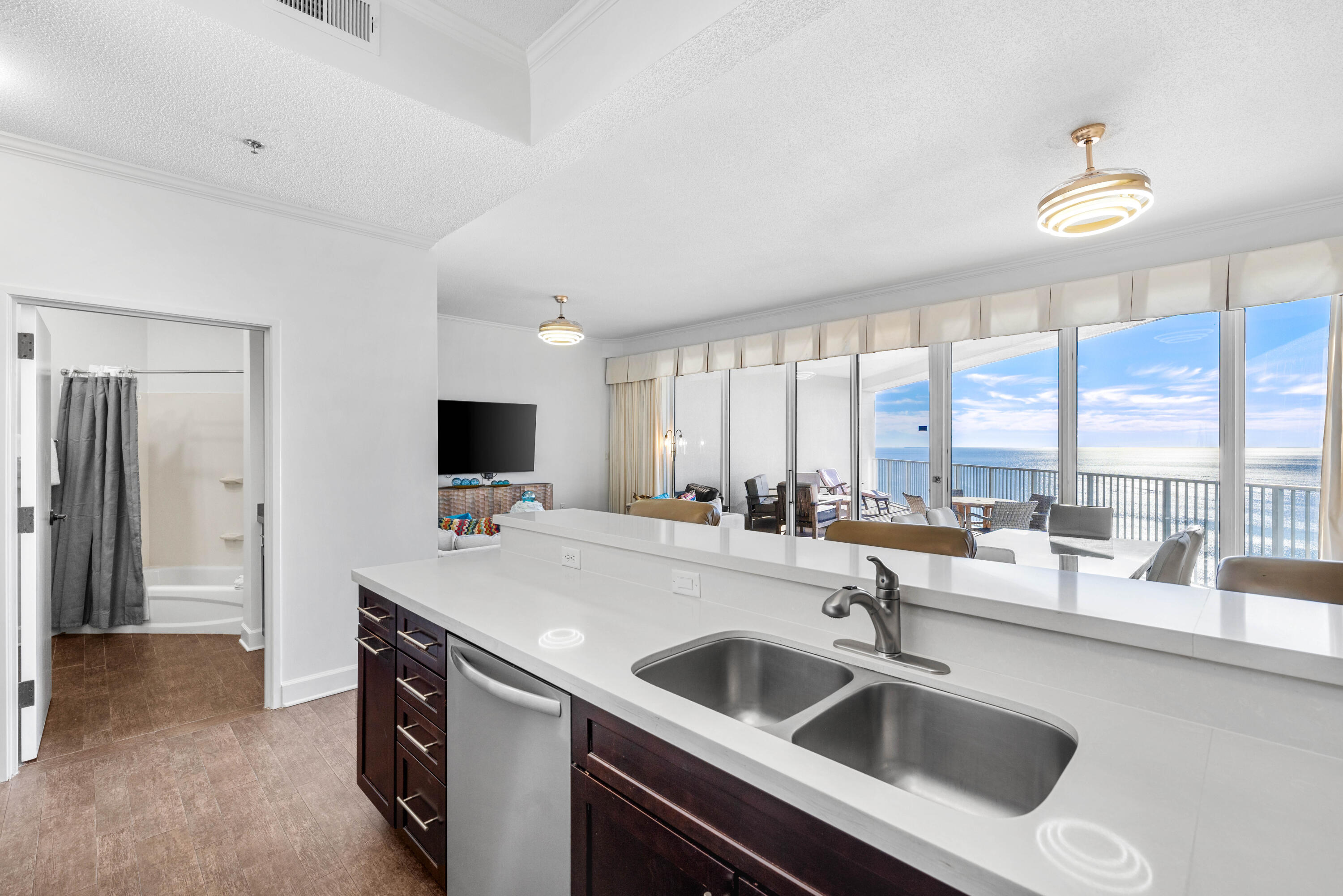 550 Tops'l Beach Boulevard, Unit 1509 Miramar Beach, FL 32550 - Photo 10 of 31 a kitchen with a sink and a refrigerator