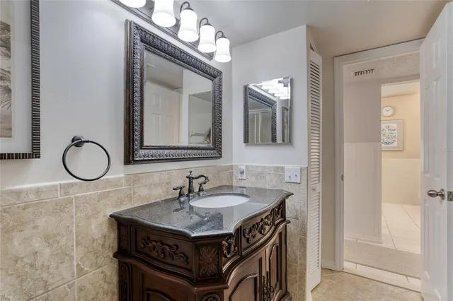 a bedroom with a bed and ceiling fan