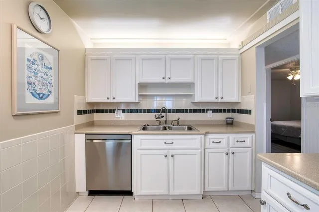 a kitchen with a refrigerator sink and microwave