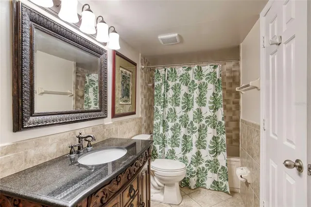 a bedroom with a bed and a table