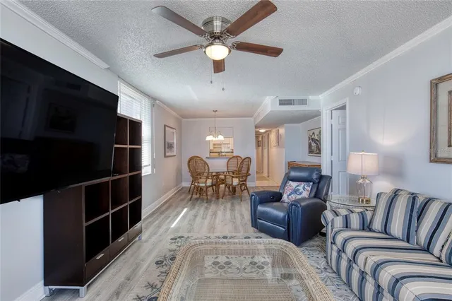 a living room with furniture cabinets and window