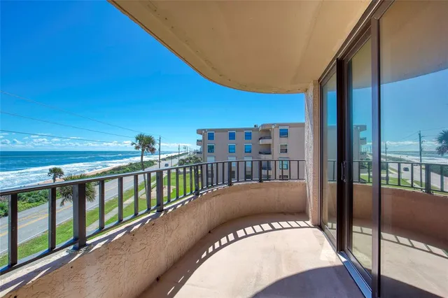 a view of balcony with furniture