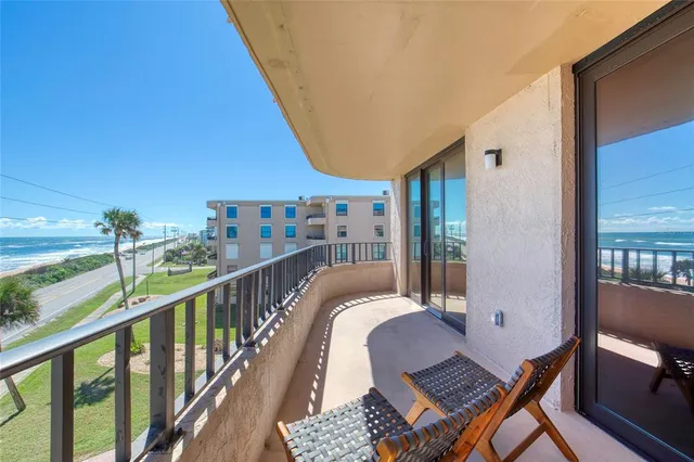 a living room with fireplace furniture and a flat screen tv