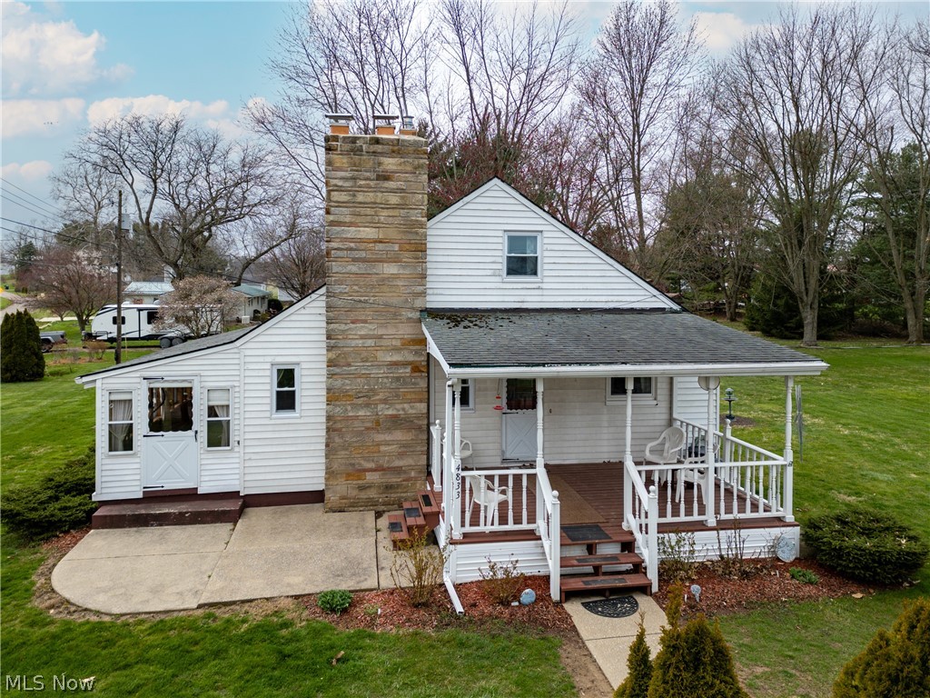 4833 Angling Road Wooster, OH 44691 - Photo 2 of 49 Rear view of property featuring a lawn and a porch