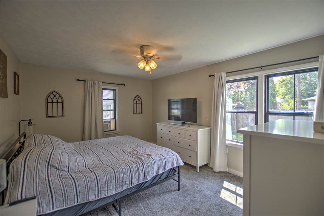 6 2nd South Shores Avenue Decatur, IL 62521 - Photo 13 of 24 a bedroom with a large bed and a tv