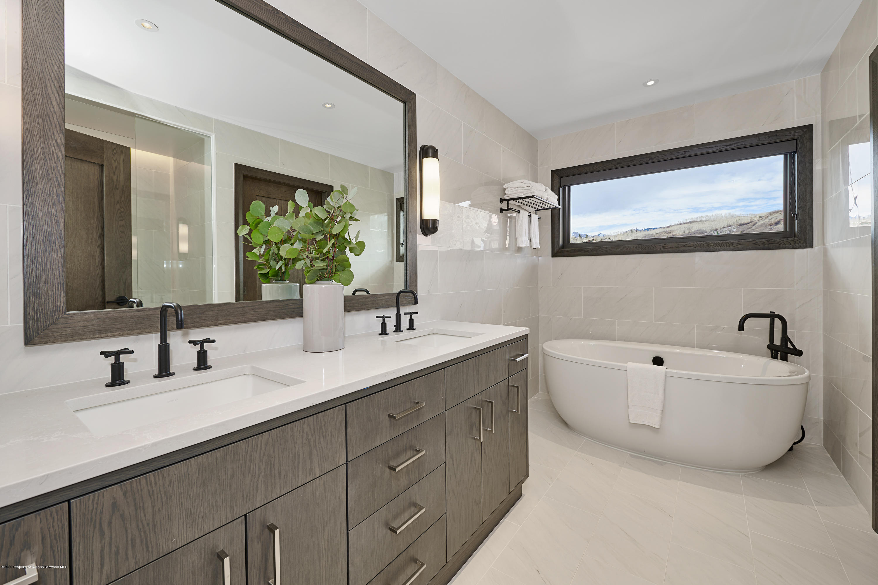 65 Wood Road, Unit 433 Snowmass Village, CO 81615 - Photo 14 of 27 a bathroom with a double vanity sink mirror and bathtub