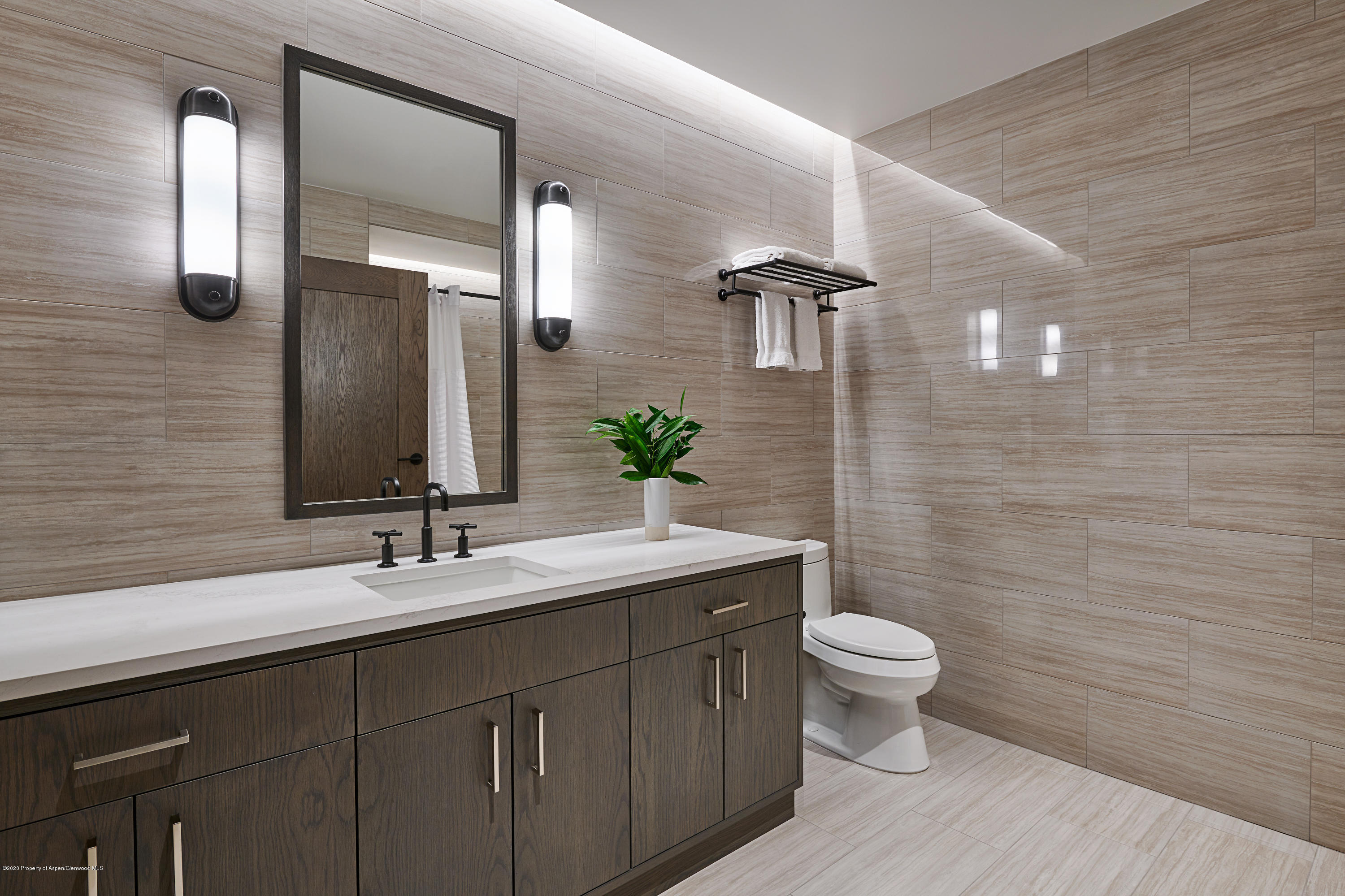 65 Wood Road, Unit 433 Snowmass Village, CO 81615 - Photo 16 of 27 a bathroom with a double vanity sink toilet and a mirror