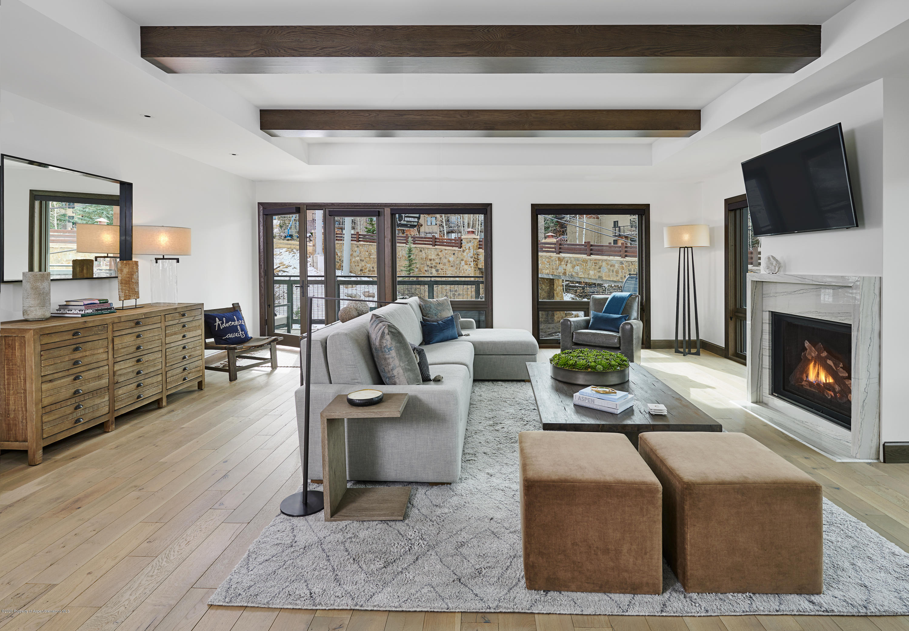 65 Wood Road, Unit 433 Snowmass Village, CO 81615 - Photo 3 of 27 a living room with fireplace furniture and a flat screen tv